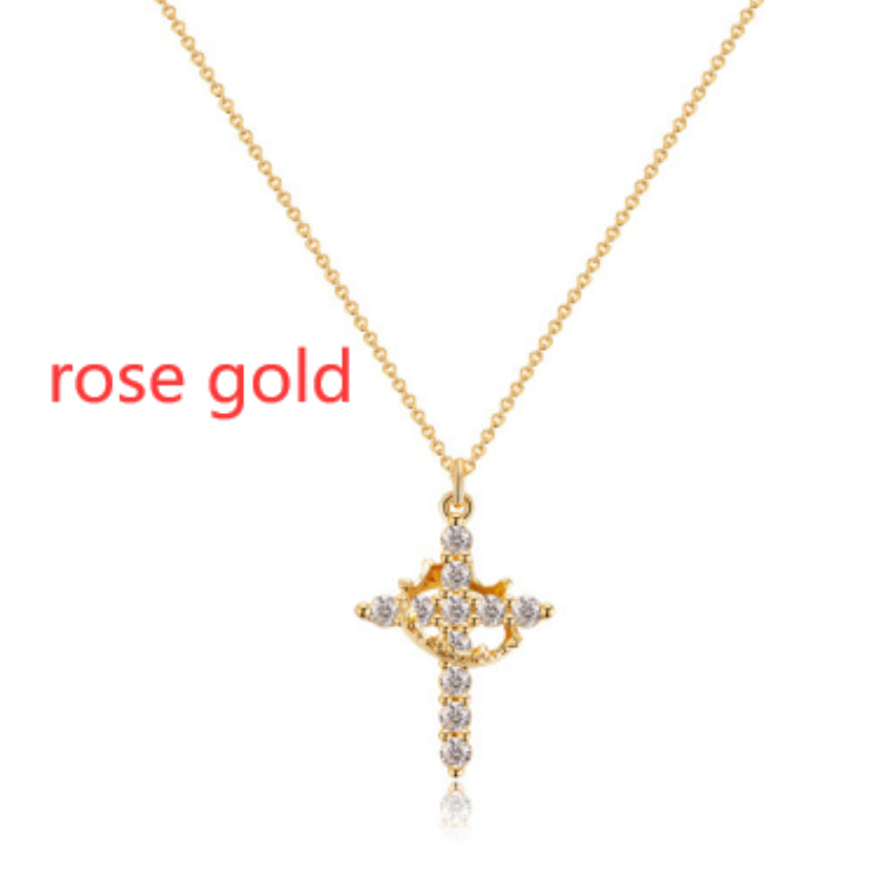 Collier rotatif couronne en croix serti de faux diamants