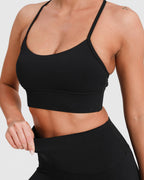 Sport-BH Racerback stützend mit herausnehmbaren Pads – Schwarz