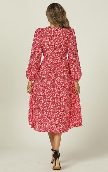 Robe mi-longue rouge à imprimé floral, col en V et manches longues, avec patte de boutonnage