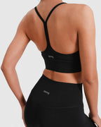 Sport-BH Racerback stützend mit herausnehmbaren Pads – Schwarz